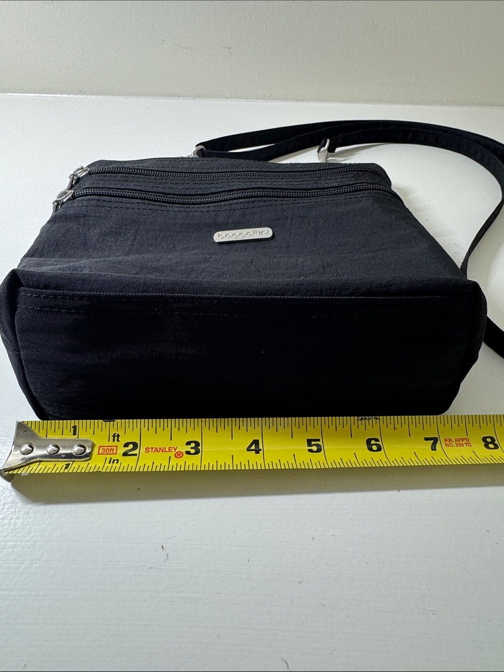 Baggalini black nylon crossbody bag with matching integrated mini bag/wallet. - Picture 4 of 16